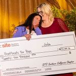 Two women hold a large ceremonial check for $22,000 donation made out to Hoofbeats For Hope from SITE Southern California Chapter during the 2026 Installation Two women hold a large ceremonial check for $22,000 made out to Hoofbeats For Hope from SITE Southern California Chapter at the 2026 Installation Dinner + Incentive Experience