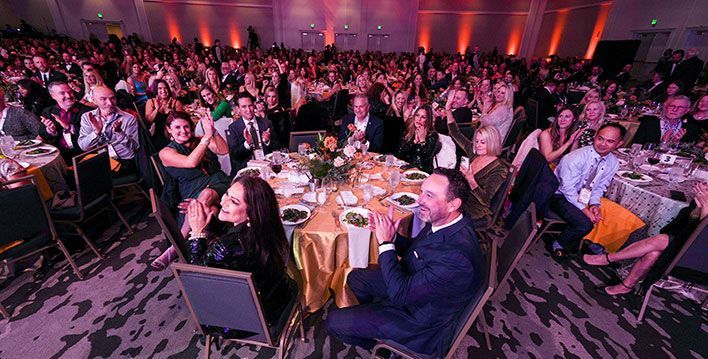 applauding crowd at awards dinner